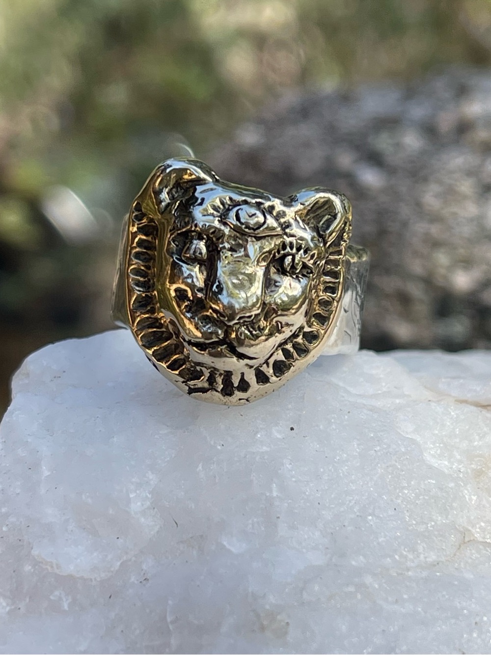 Jes Maharry lioness ring in 14k gold and sterling silver band .